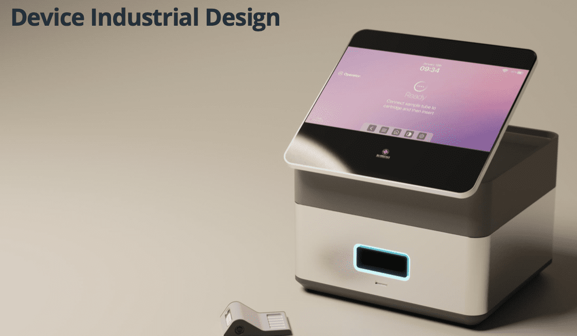 A sleek electronic device with a tilt-up touchscreen displaying a digital interface. The screen reads: "Device Industrial Design." A small item is on the table next to the device.